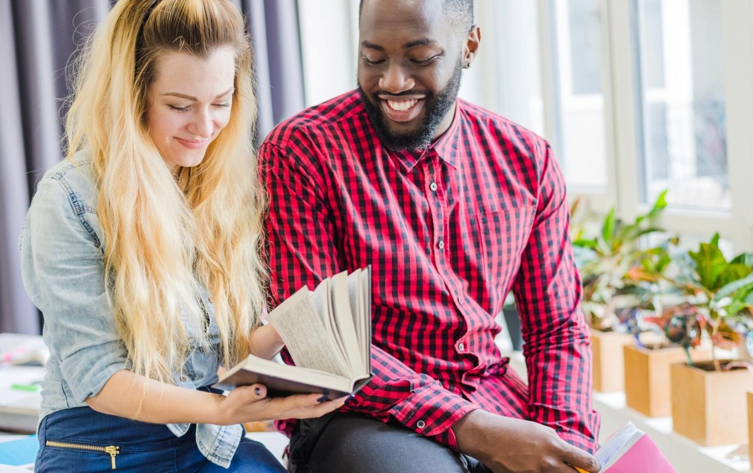 Financial team collaborating on strategic planning with documents and analytical tools spread across a conference table